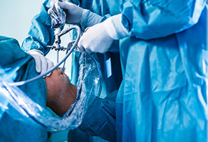 Doctor performing a knee surgery